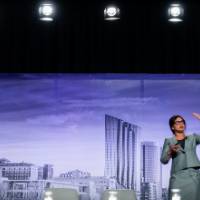 Paul Isely and Kuhelika De presenting on the economy of Grand Rapids